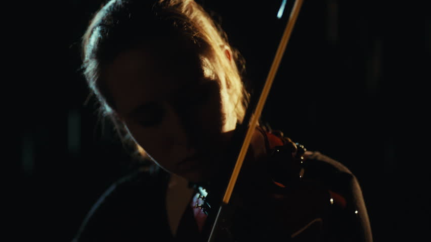Female student of musical school performing melody by violin, romantic music. Talented young woman playing musical instrument, closeup portrait, enjoy culture, relax and meditate by classical music