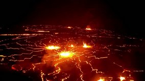 Nighttime aerial shot of a glowing lava field with multiple volcanic fissures and eruptive vents. The molten landscape radiates intense heat, emphasizing geothermal energy and raw natural power. - Powered by Shutterstock - Get 15% off with code: PIKWIZARD15