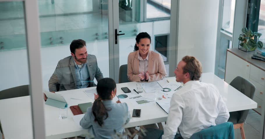 Business, people and meeting with handshake in office for partnership, agreement and finance deal. Above, men and shaking hands with discussion, promotion applause and bonus achievement of investment