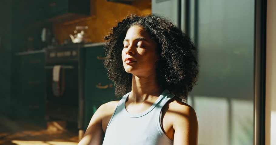 Yoga, meditation and woman with breathing in home for holistic wellness, mindfulness and awareness. Calm, african person and zen in apartment for spiritual healing, stress relief and align chakra