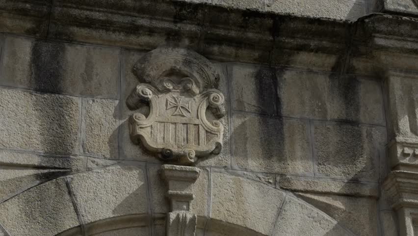Old Weathered Stone Door Arches With A Carved Coat Of Arms At The Top