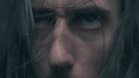 Close-Up of Distressed Man with Disheveled Hair and Intense Expressions - Powered by Shutterstock - Get 15% off with code: PIKWIZARD15