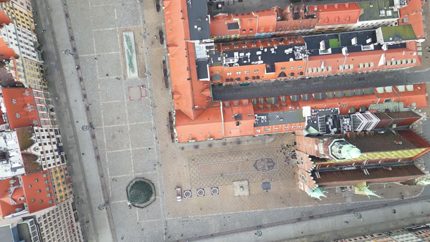 Wroclaw, Poland: Aerial overhead footage of the famous market square in Wroclaw medieval old town with the ancient town hall in Poland. Shot with a rotation motion