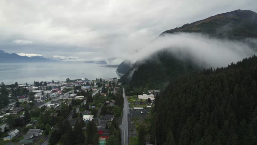 Lakeside township and an endless landscape in Alaska, aerial view