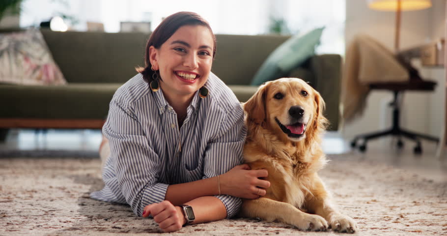Relax, face and woman with dog in living room in home for bonding, connection or companion. Happy, adoption and portrait of female person on floor with golden retriever pet for rubbing animal.