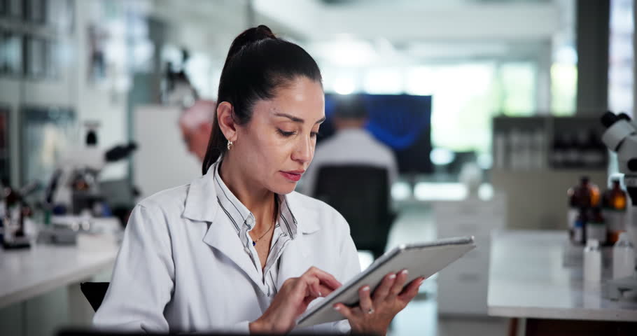 Scientist, woman and tablet in laboratory for research, problem solving or thinking of development. Medical, science and doctor with technology for pharma, insight and scroll peer review journal