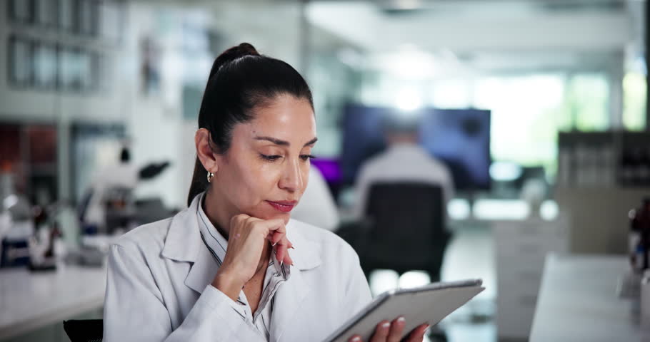 Scientist, woman and tablet in laboratory for research, problem solving or thinking of development. Medical, science and doctor with technology for pharma, insight and scroll peer review journal