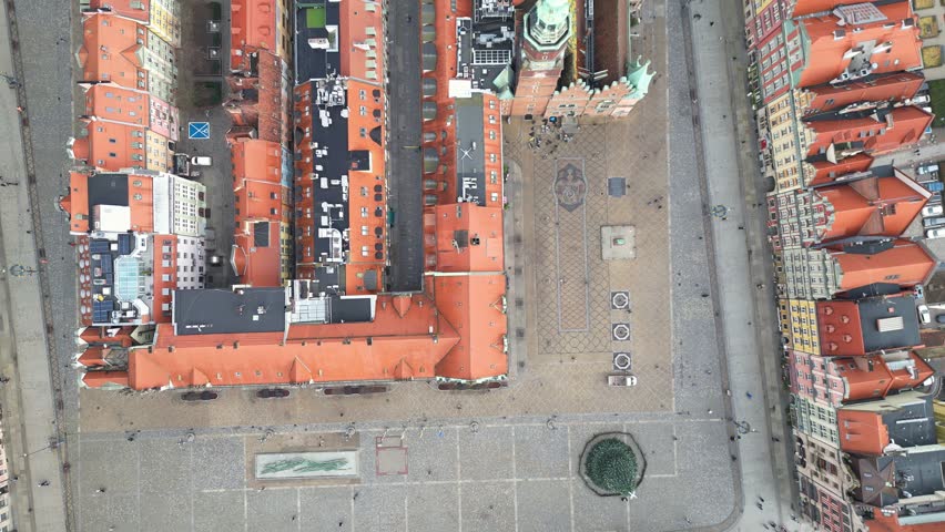 Wroclaw, Poland: Aerial overhead footage of the famous market square in Wroclaw medieval old town with the ancient town hall in Poland