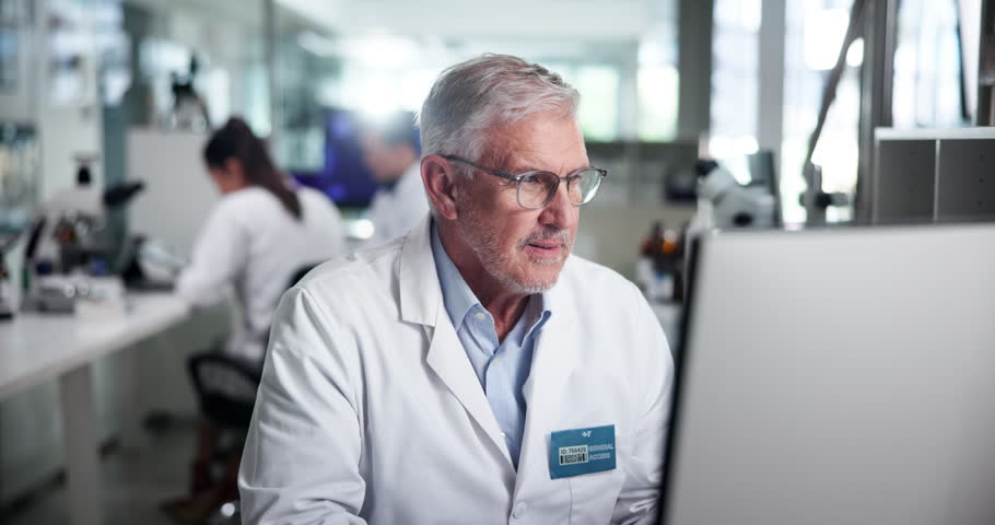 Science, mature or face of happy man on computer for test research, development or innovation. Medical, smile or confident scientist with biotechnology for pharma, microbiology and experiment in lab