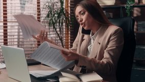 Busy young multitasking Caucasian girl business woman female businesswoman worker entrepreneur boss accountant talking mobile phone call searching documents throwing papers chaos workspace in office - Powered by Shutterstock - Get 15% off with code: PIKWIZARD15