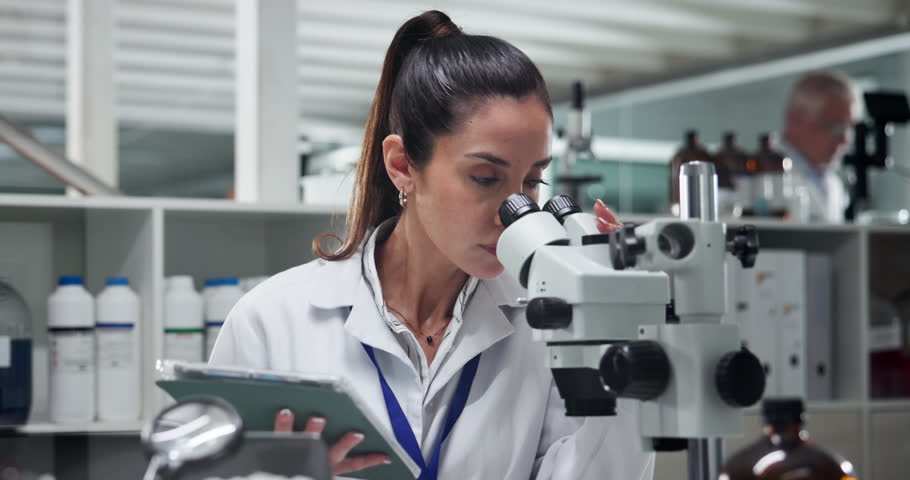 Woman, microscope and tablet at laboratory with research, test and review for results in pharmaceutical study. Person, scientist and clinical trial for medicine, application and solution by laptop