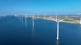 Numerous wind turbines stretch across the vast offshore waters in the Netherlands, showcasing sustainable energy production. offshore windmill turbines in the ocean, green energy transition - Powered by Shutterstock - Get 15% off with code: PIKWIZARD15