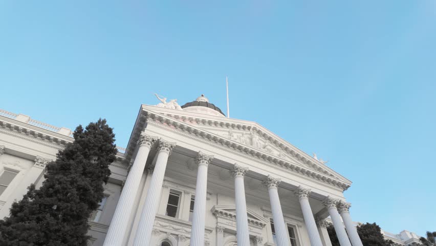 A stunning view of the California State Capitol in Sacramento, showcasing its historic design against a vibrant sky.