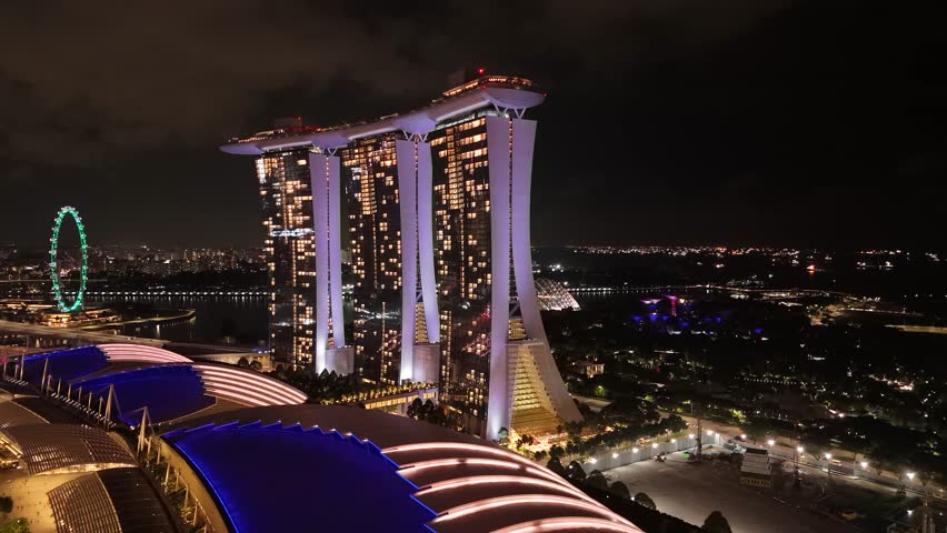 Modern Marina Bay Sands building complex in Singapore at night. Aerial