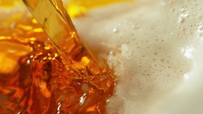 Super Slow Motion Detail Shot of Pouring and Splashing Beer at 1000fps. - Powered by Shutterstock - Get 15% off with code: PIKWIZARD15