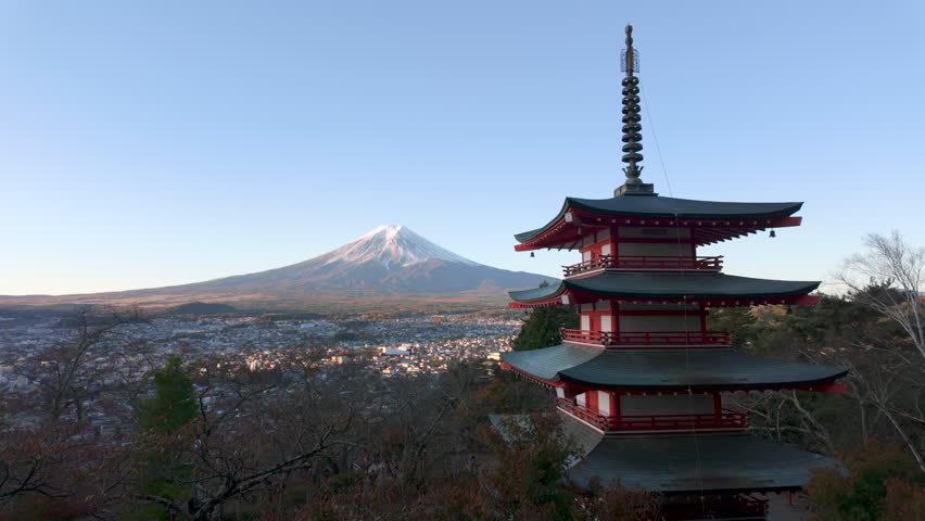 Tilt up shot showing Mount Fuji with the historic Chureito Pagoda during the autumn season in Fujiyoshida, Yamanashi, Japan.