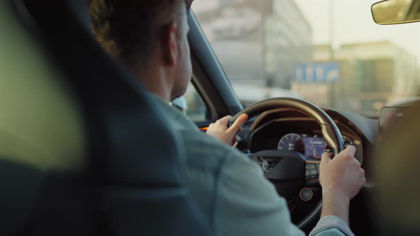 Man driving car through the streets of the city