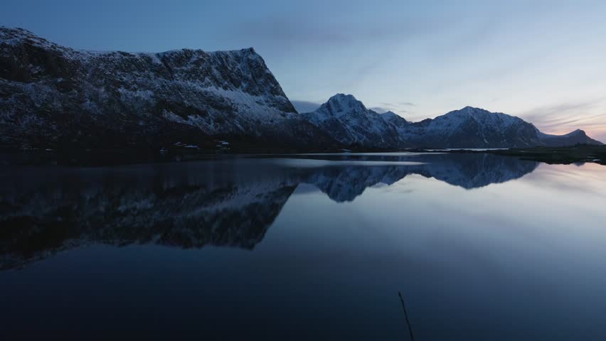 Panoramic view of a fjord at dusk in Norway. Nordic windless evening; Lofoten Islands, Northern Norway.