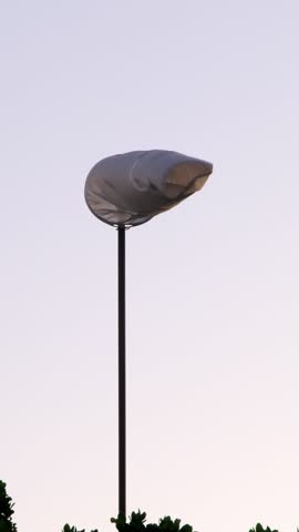 The windsock waves in the wind, showing the direction and strength of the wind at the airfield.