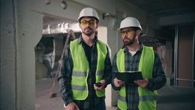 Professional Caucasian architects males guys foremen mechanics teamwork men miners speaking building industrial construction builders employees talking walkie talkie in factory engineers supervising - Powered by Shutterstock - Get 15% off with code: PIKWIZARD15