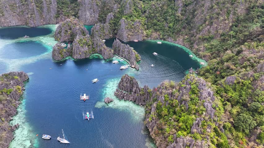 Aerial view of Twin Lagoon, Coron, Philippines. Natural wonder, sharp cliffs, pristine waters.