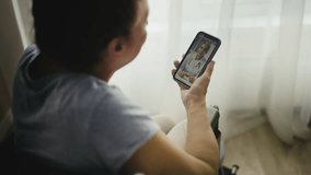 Senior woman in wheelchair consulting with doctor via videocall, health concerns - Powered by Shutterstock - Get 15% off with code: PIKWIZARD15