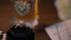 Close up view of the engagement ring in the dark velvet ring box. Wedding Jewelry - Powered by Shutterstock - Get 15% off with code: PIKWIZARD15