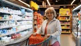 Senior Housewife with Full Shopping Cart in Supermarket - Powered by Shutterstock - Get 15% off with code: PIKWIZARD15