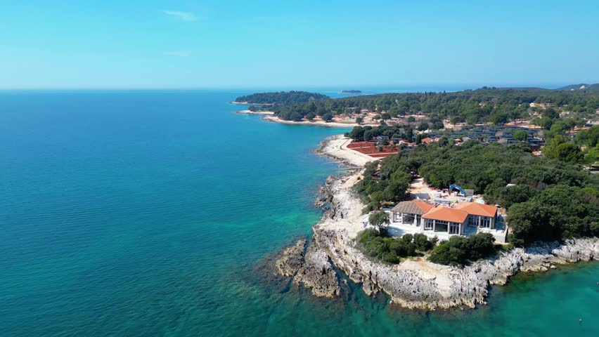 Aerial photo of the stunning Limski Kanal and Camping Koversada near Vrsar, Croatia. The landscape features lush greenery, crystal-clear turquoise waters, and winding coastline — a true Adriatic