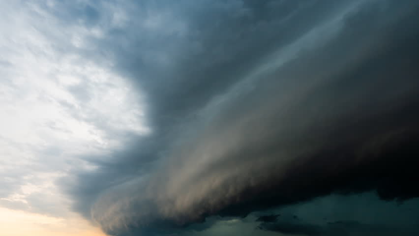 Powerful nature timelapse features dramatic black clouds rolling through the sky, capturing intense weather shifts and the awe-inspiring movement of stormy skies in stunning detail