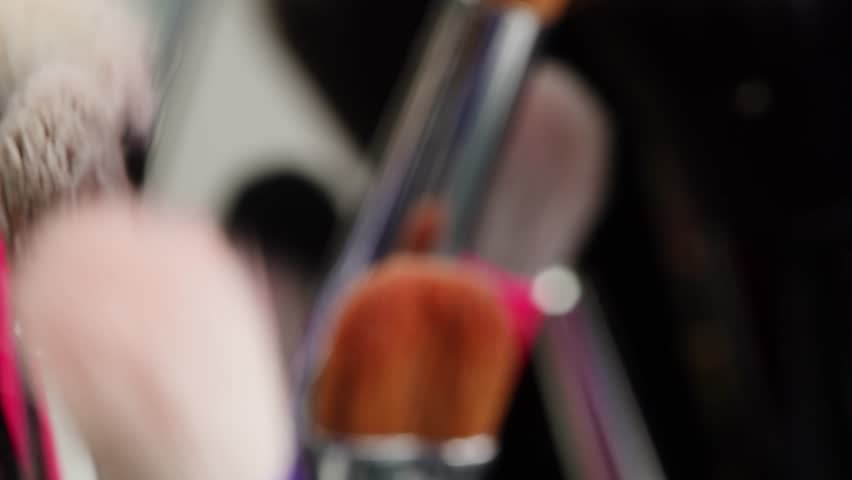 Make up brush close up macro texture in shop, supermarket. Artist studio fashion work, backstage.