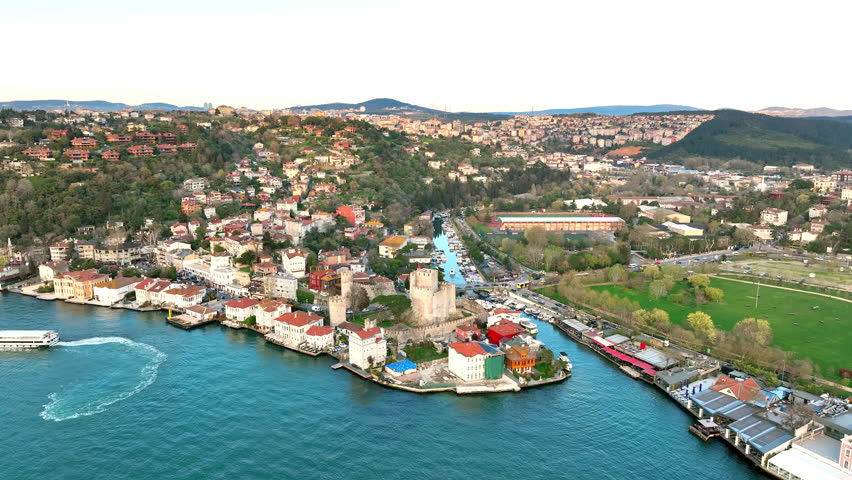 Fatih Sultan Mehmet Bridge and Anadolu Hisari (Anatolian Fortress) in Istanbul, Turkey. Beautiful Istanbul bosphorus landscape. Drone shot.
