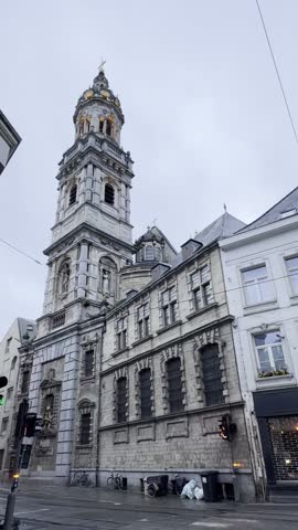 The ornate tower of St. Carolus Borromeus Church in Belgium rises above Antwerp’s narrow streets, its Baroque beauty blending spiritual grandeur and architectural elegance in the city’s historic heart