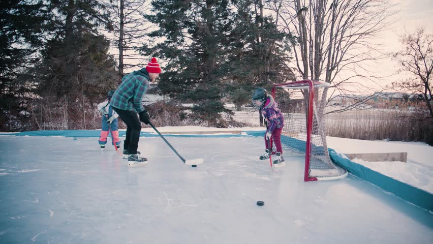 Family of hockey players on ice