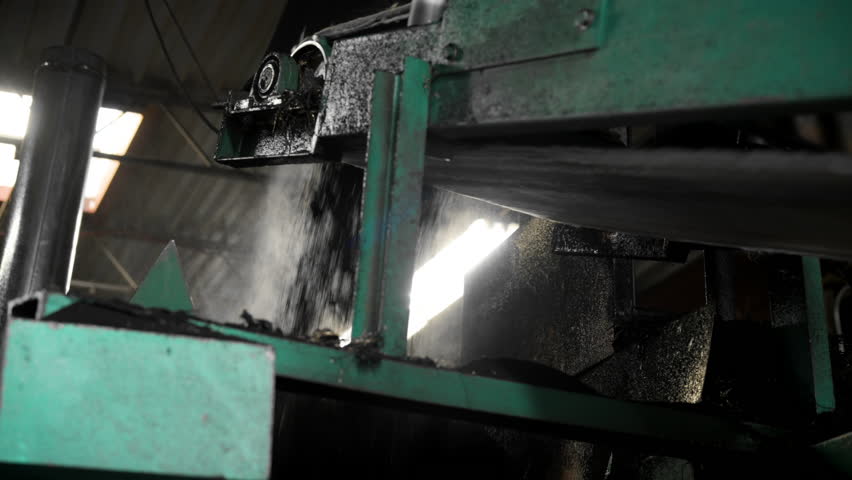 Crushed tires processed in a recycling plant, showcasing sustainable waste management solutions.