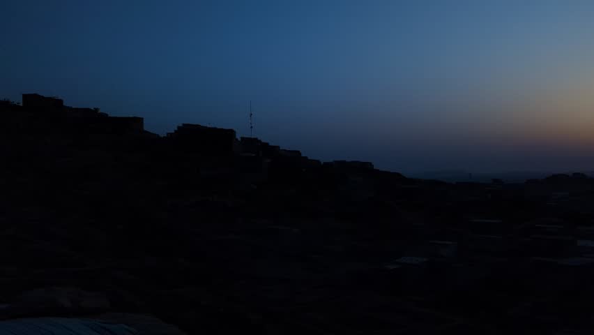 Under the vast nightscape, stars shimmer like scattered diamonds, illuminating the darkness with quiet wonder, while the sky whispers secrets in a blanket of cosmic light.