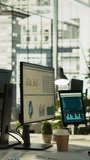 Vertical video Tablet and PC on desk displaying financial graphs of company profits performance metrics. Data analytics on device display showing corporate business earnings KPIs. panning shot - Powered by Shutterstock - Get 15% off with code: PIKWIZARD15