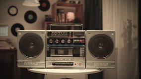 Retro music radio tape recorder, audio cassette playing close-up VHS. Listening to music, recording studio old radio boombox player, searching channel, volume.  - Powered by Shutterstock - Get 15% off with code: PIKWIZARD15