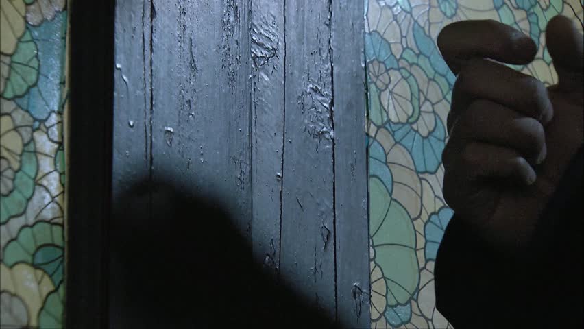 Knocking on the door, close-up of hand movements