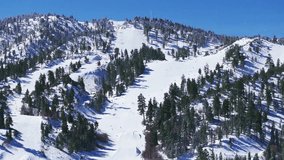 Experience skiing and snowboarding at Big Bear, California, amidst breathtaking views of snow and mountains in a captivating winter wonderland - Powered by Shutterstock - Get 15% off with code: PIKWIZARD15
