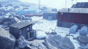 Scientists conduct experiments and study weather conditions at an old research station surrounded by icy landscapes in Antarctica. - Powered by Shutterstock - Get 15% off with code: PIKWIZARD15