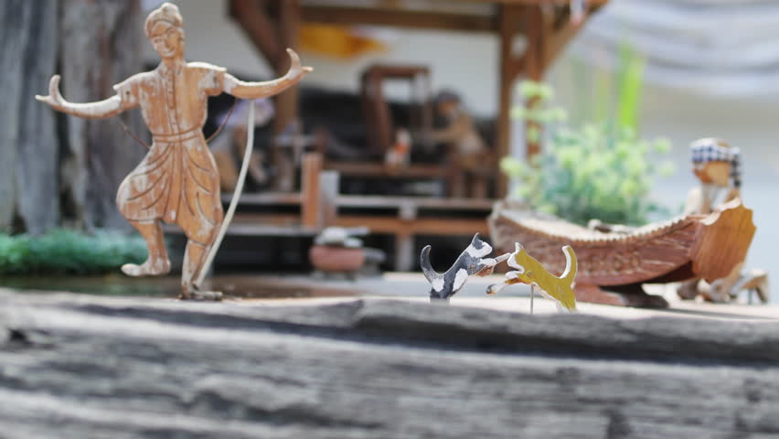 The wooden mechanized toy men.