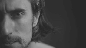 Close-Up Black and White Portrait of Male Subject Showing Intense Facial Expressions - Powered by Shutterstock - Get 15% off with code: PIKWIZARD15