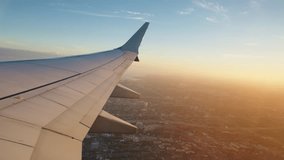 Experience the breathtaking and stunning view from an airplane window during the exhilarating takeoff at night, showcasing the beautiful illuminated city sprawling below against the twilightlit sky - Powered by Shutterstock - Get 15% off with code: PIKWIZARD15
