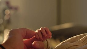 Newborn Grasping Parent's Hand Inside The Room. Close-up Shot - Powered by Shutterstock - Get 15% off with code: PIKWIZARD15