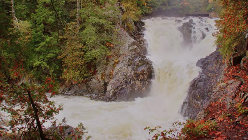 This 4K footage captures the stunning Roaring Brook Falls in the Adirondacks, showcasing the power and beauty of the cascading water against a serene forest backdrop.