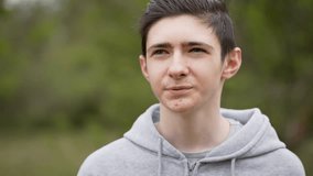 Portrait teenage boy talking about teenage acne and puberty. Young man discussing his pimples and challenges of adolescence. Adolescent boy sharing experiences with acne and puberty changes - Powered by Shutterstock - Get 15% off with code: PIKWIZARD15