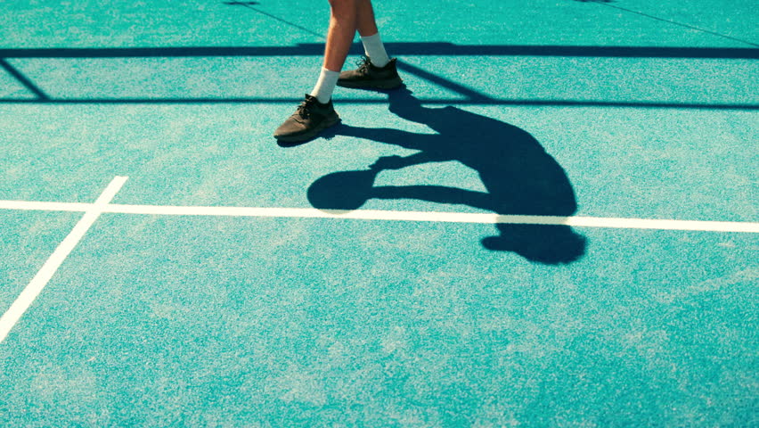 Sports, tennis court and feet of person with ball for game, match and competition outdoors. Fitness, padel and legs of athlete for training, exercise and workout for tournament, challenge or practice