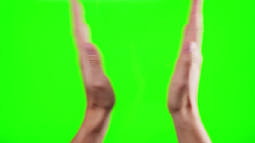 Hands clapping on green screen background. Male hands silhouette clapping on a chroma key background. High quality 4k footage