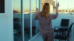 Jubilant female enjoying triumph, dancing spontaneously on city rooftop with wine, radiating freedom and bliss during warm sunset lighting - Powered by Shutterstock - Get 15% off with code: PIKWIZARD15